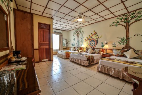 Standard Room—one of our rooms with three queen-size beds, perfect for families or small groups.