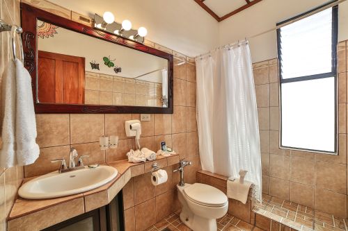 Standard Room bathroom—spacious layout with modern fixtures and amenities.