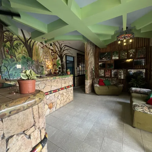 Stone-front desk with Mayan-style carvings in the lobby.