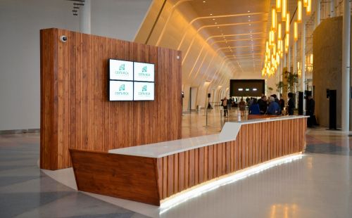 Reception desk with Costa Rica Convention Center branding and video wall.