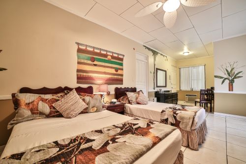 Standard Room—two or three queen beds, bright, airy, and spotless.