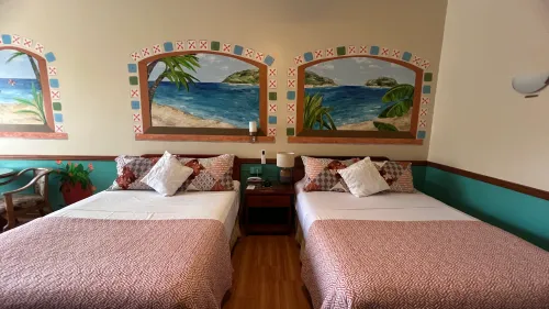 Standard Room—two queen beds and rainforest mural.