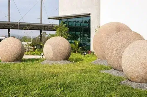 Pre-Columbian stone spheres in the landscaped garden courtyard.