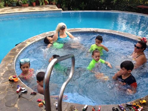 Families splashing in the jacuzzi.